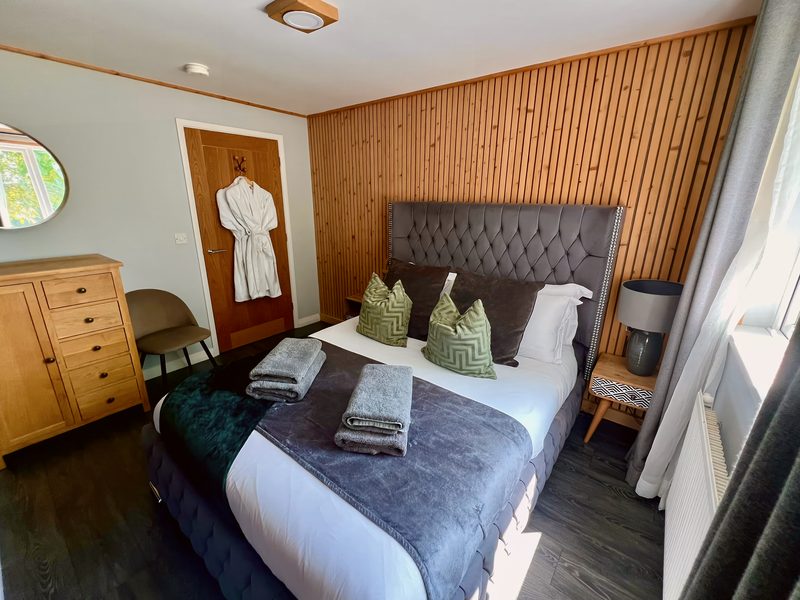 Bedroom 2: king-size, chest of drawers and armchair