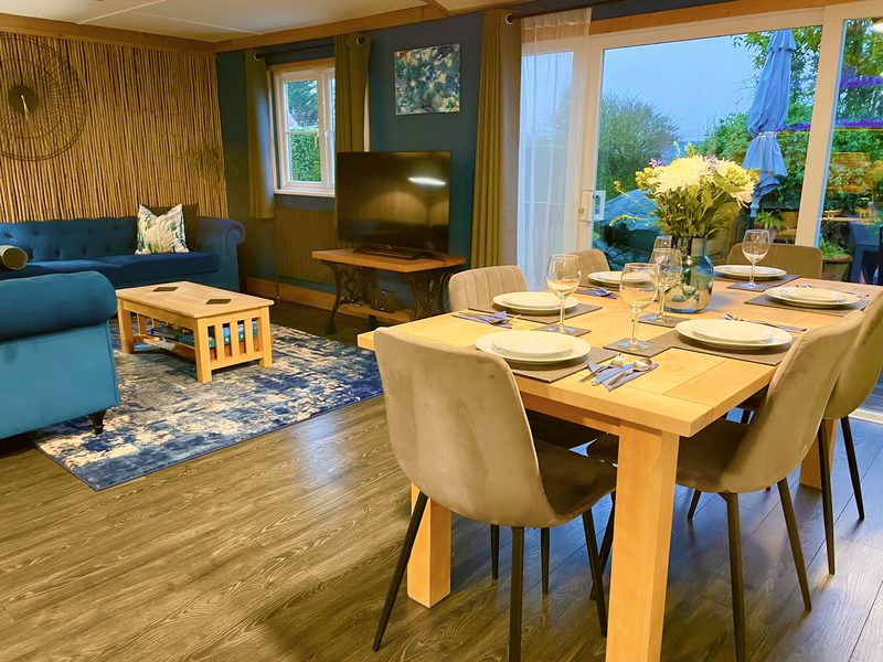 Dining table, doors to the decking