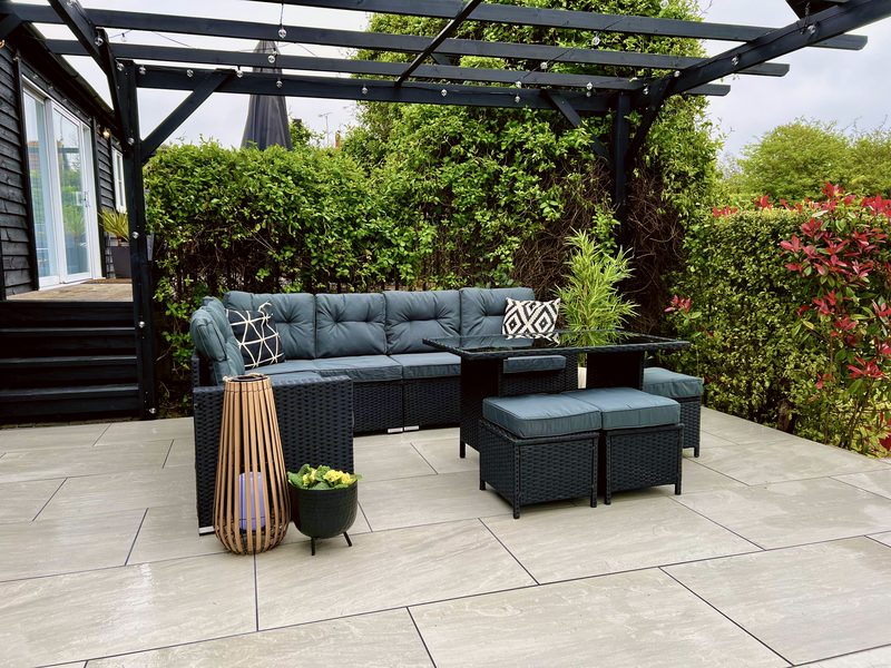 Pergola patio with a big corner sofa